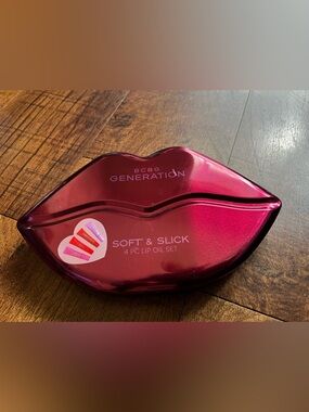 New in box BCBGeneration Lip Oil Set - Shimmery Magenta Lip-Shaped Case